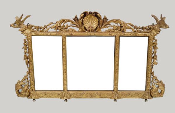 An Irish 19th-century carved giltwood overmantel at Sheppard's. An Irish 19th-century carved giltwood overmantel at Sheppard's.